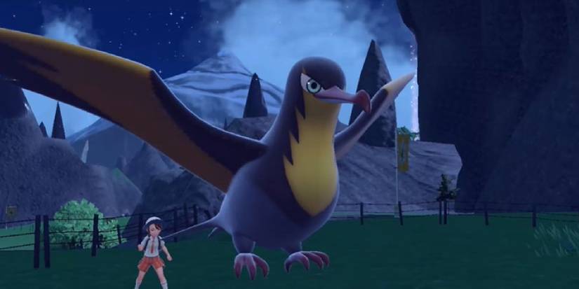 Kilowattrel flying in a nighttime battle in Scarlet & Violet