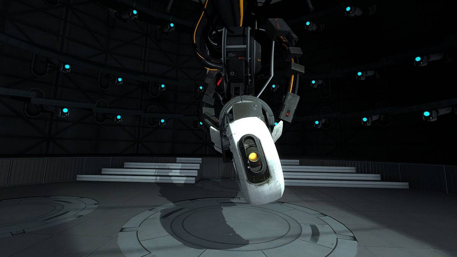 Screenshot from Portal 2 showing GLaDOS in a dark room.