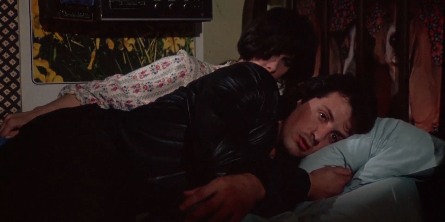 Sylvester Stallone as Rocky in bed with Talia Shire as Adrian