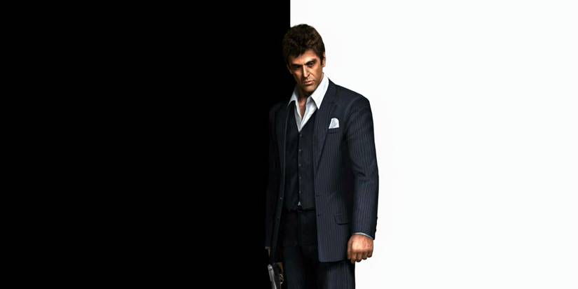 Tony Montana poses in a suit