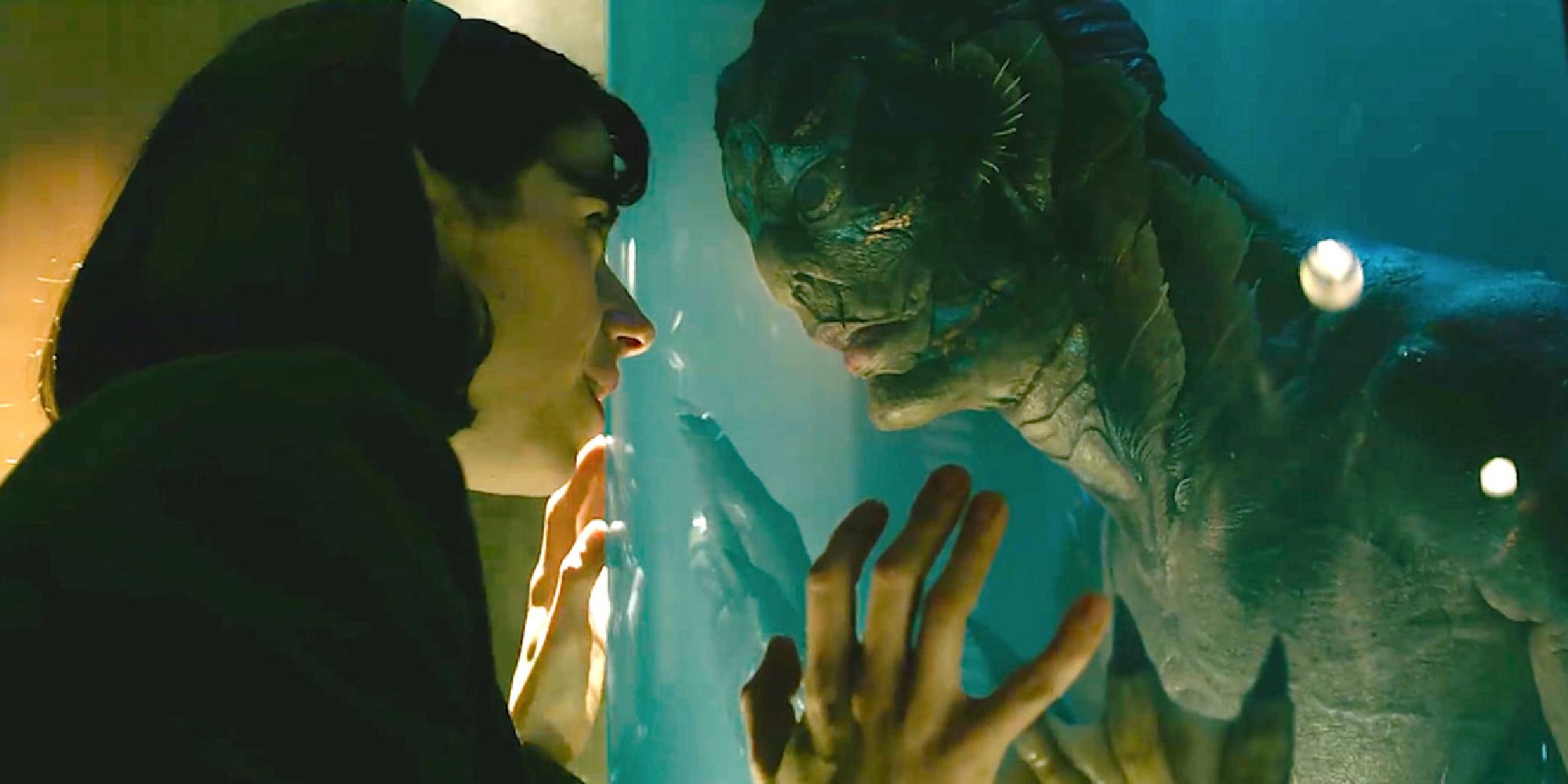 Sally Hawkins staring at the fish man through glass in The Shape of Water