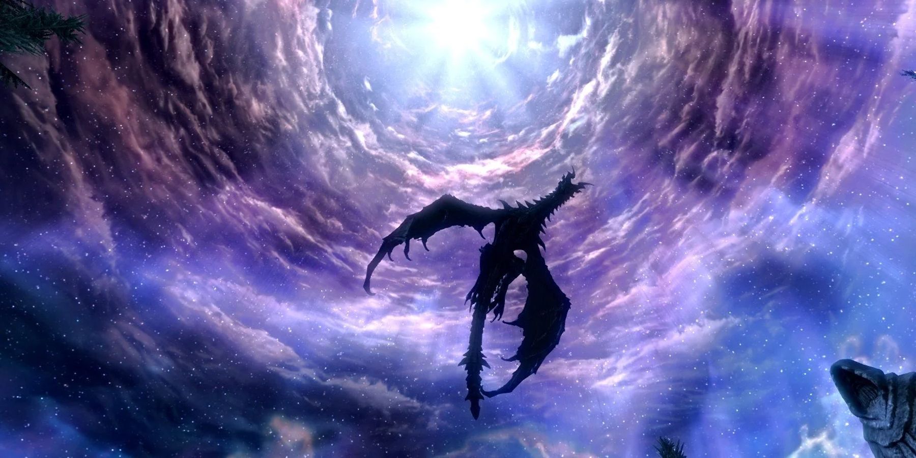 Picture of Alduin flying in the sky at the end of Skyrim