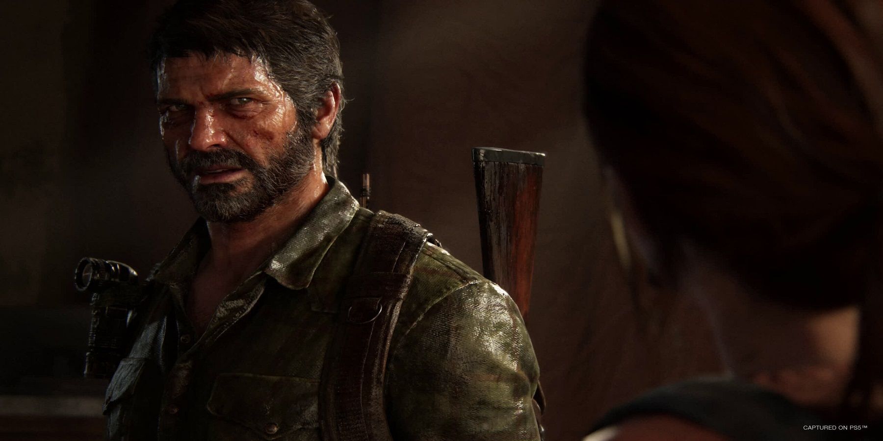 The Last of Us Part 1 Joel looks at Ellie