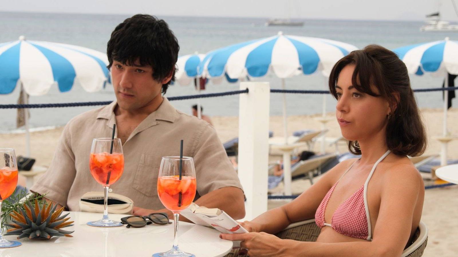 Ethan and Harper sitting at a table in The White Lotus