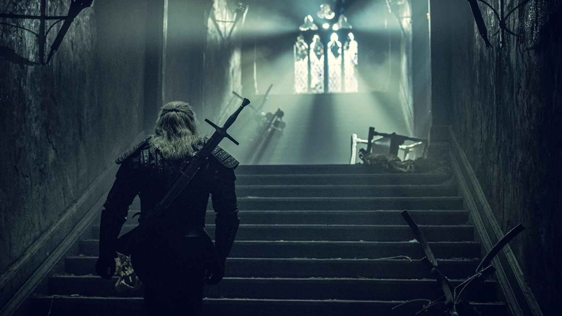 Netflix's The Witcher corridor shot with Geralt of Rivia back turned to camera