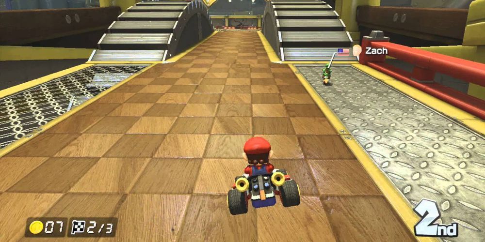 Mario jumping in second place behind racer on Tick Tock Clock track from Mario Kart DS