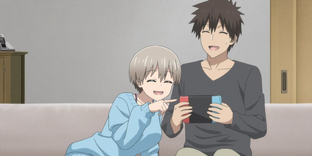 uzaki and sakurai play nintendo on a couch in uzaki-chain wants to hang out!