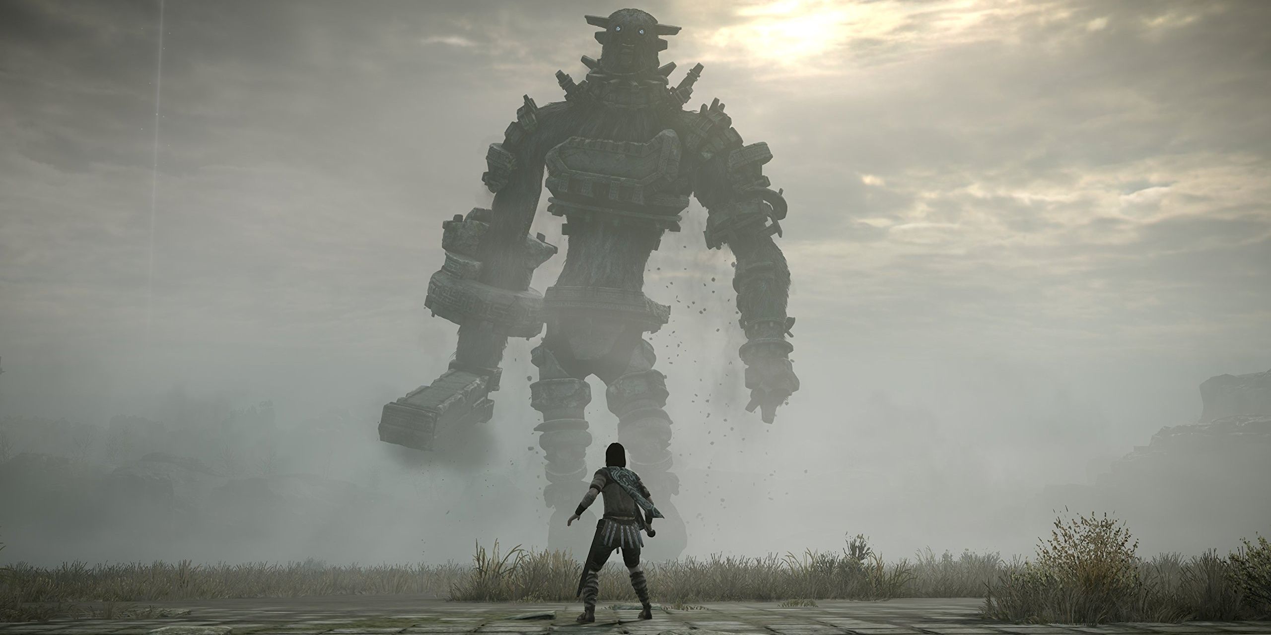Wander facing a colossus in Shadow of the Colossus