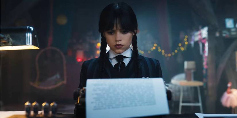 Wednesday typewriting her novel in her dorm room
