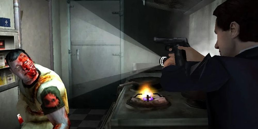 Agent Fox Mulder (right) pointing a handgun and flashlight at an infected zombie (left) inside of a kitchen with a lit gas stove burner. Image source: venturebeat.com