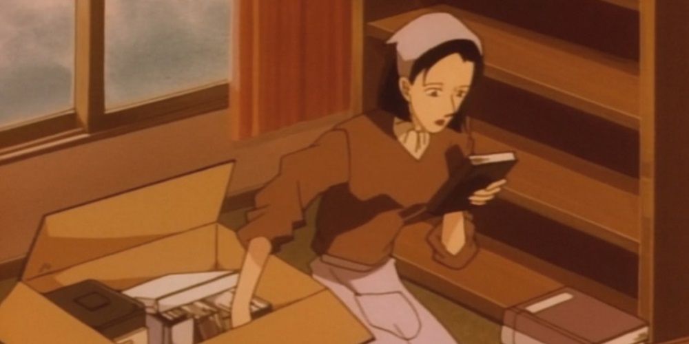 Yoko Araide observing a book in the Case Closed anime