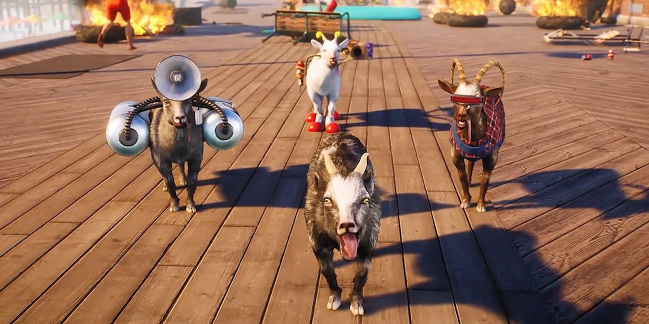 Four goats in different costumes look forward in a diamond configuration