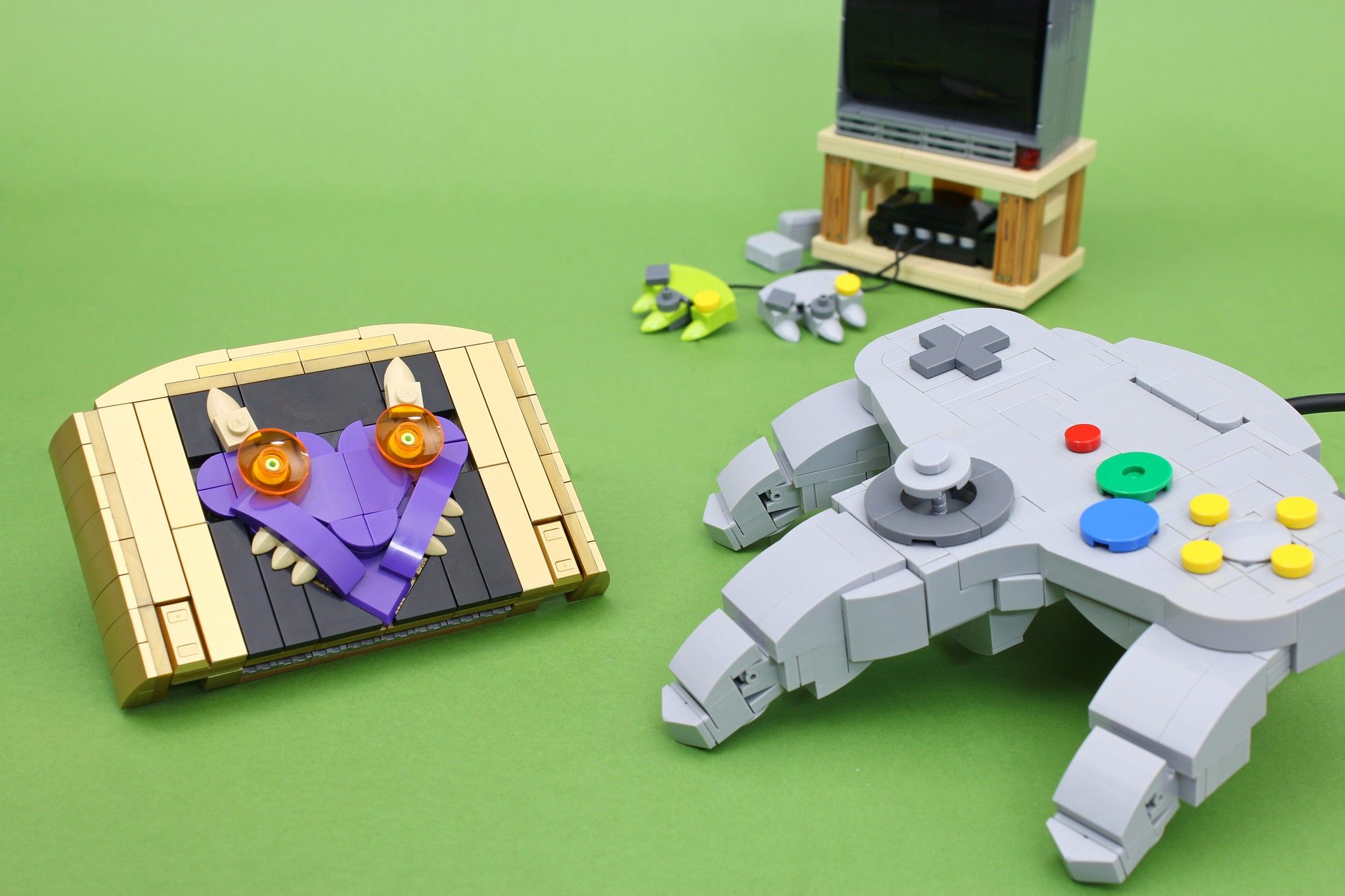 lego recreation of majora's mask cartridge and n64 controller