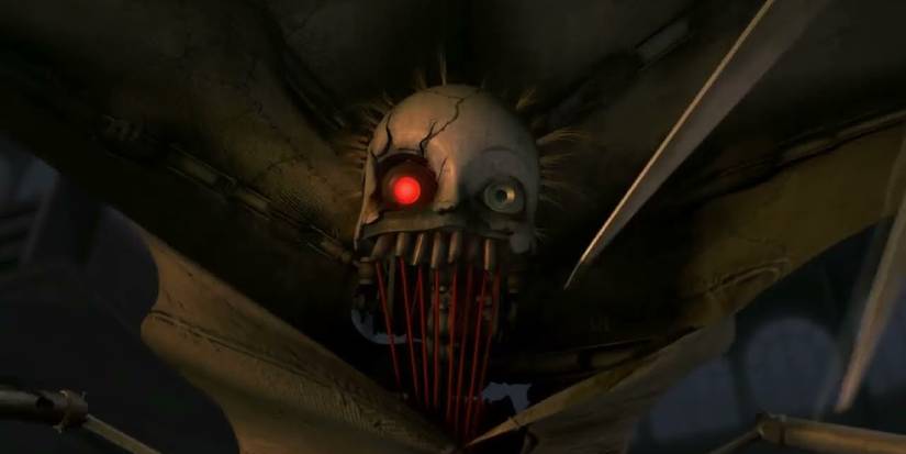 A close-up of the machine 'The Seamstress' from 9, with one mechanical eye missing, and an elongated mouth full of needle and thread. 