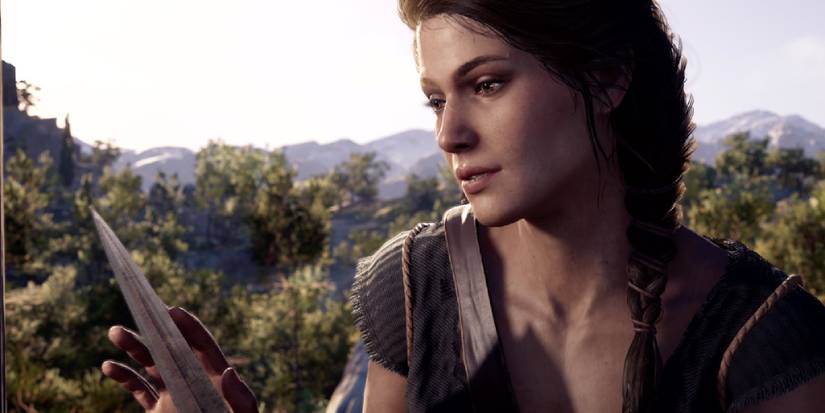 Kassandra from Odyssey, looking at a dagger she holds in her hand. 