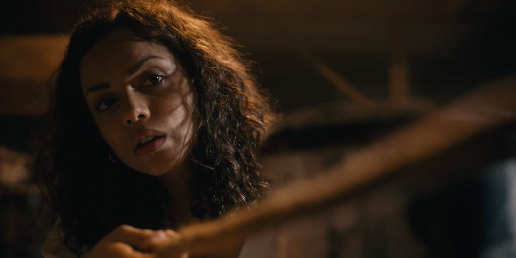 Georgina Campbell as Tess pulling a rope in Barbarian