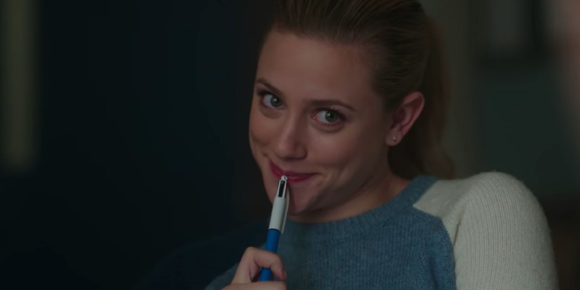 Betty holding a multicolored pen in season 2