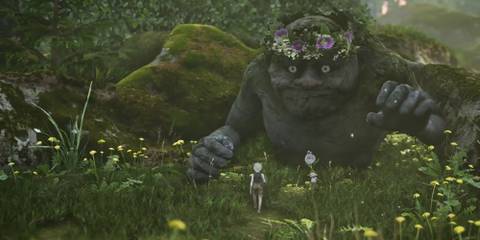 A small white-haired boy approaches a troll half-sunk into the ground. 
