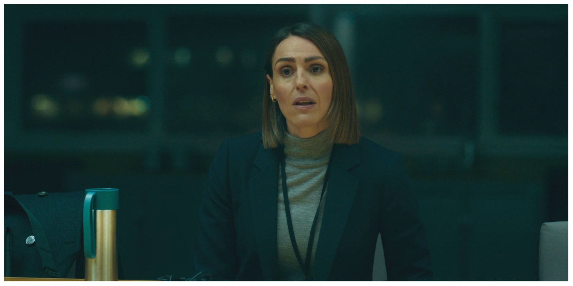 Suranne Jones in Vigil sat at a boardroom meeting table