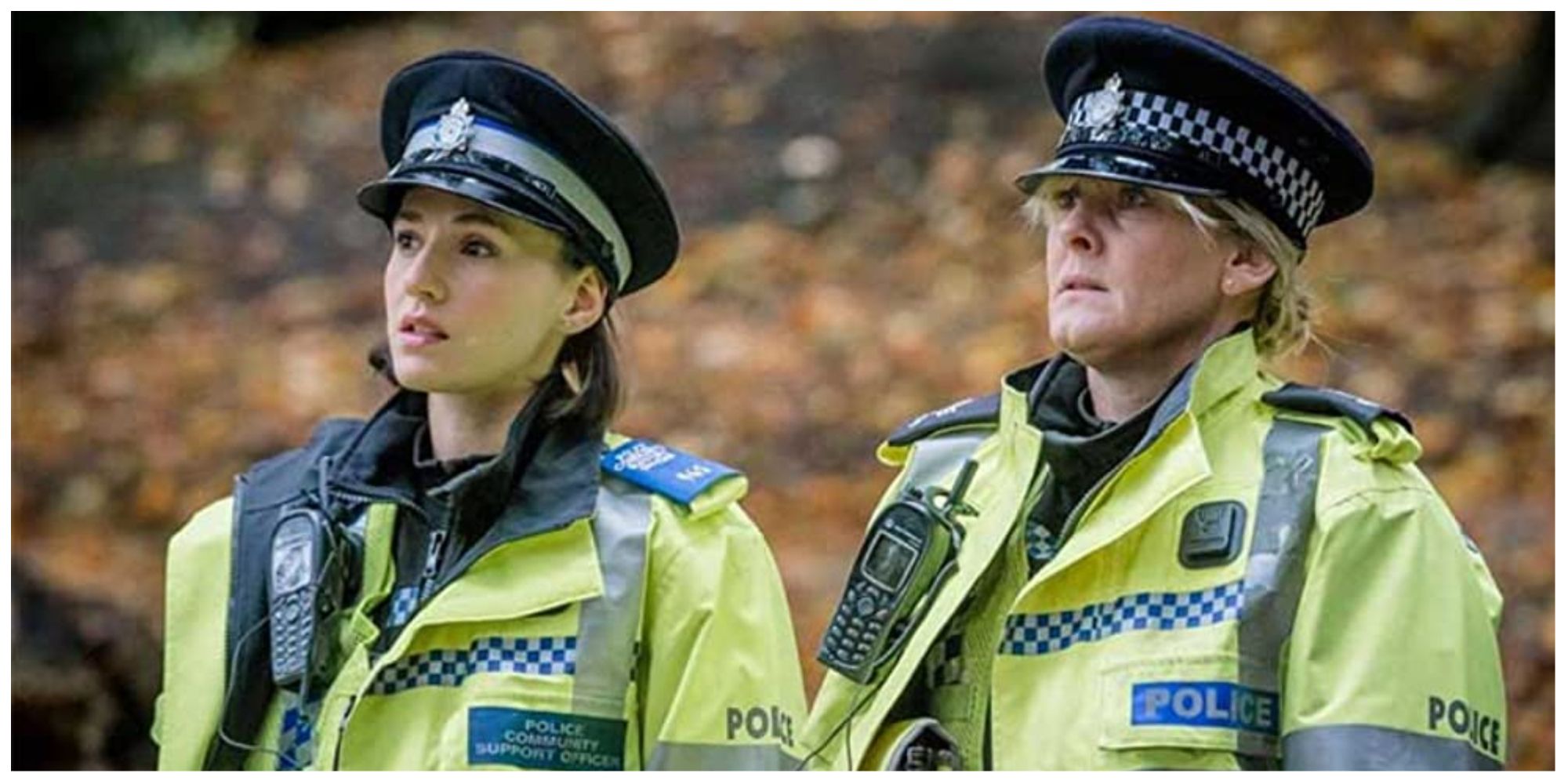 Two police officers in Happy Valley looking at a crime scene (offscreen)