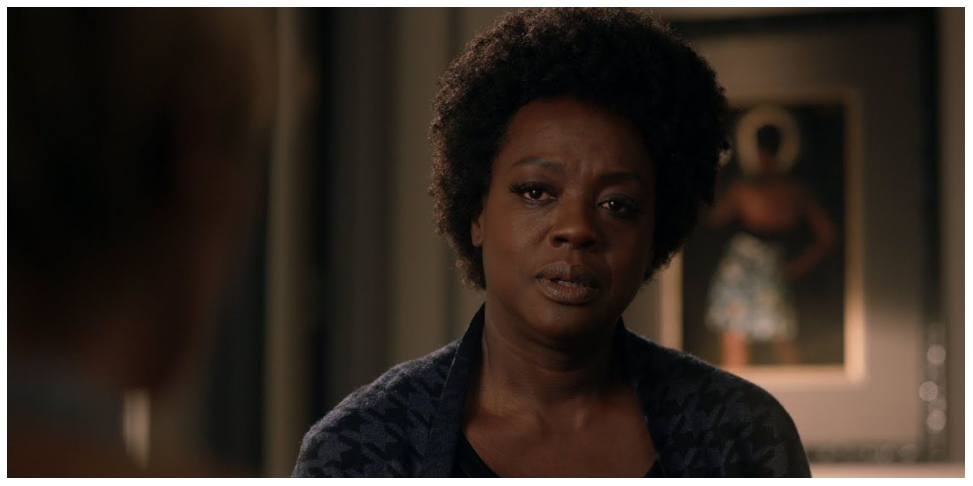 Annalise speaking with someone offscreen whilst looking concerned and stressed