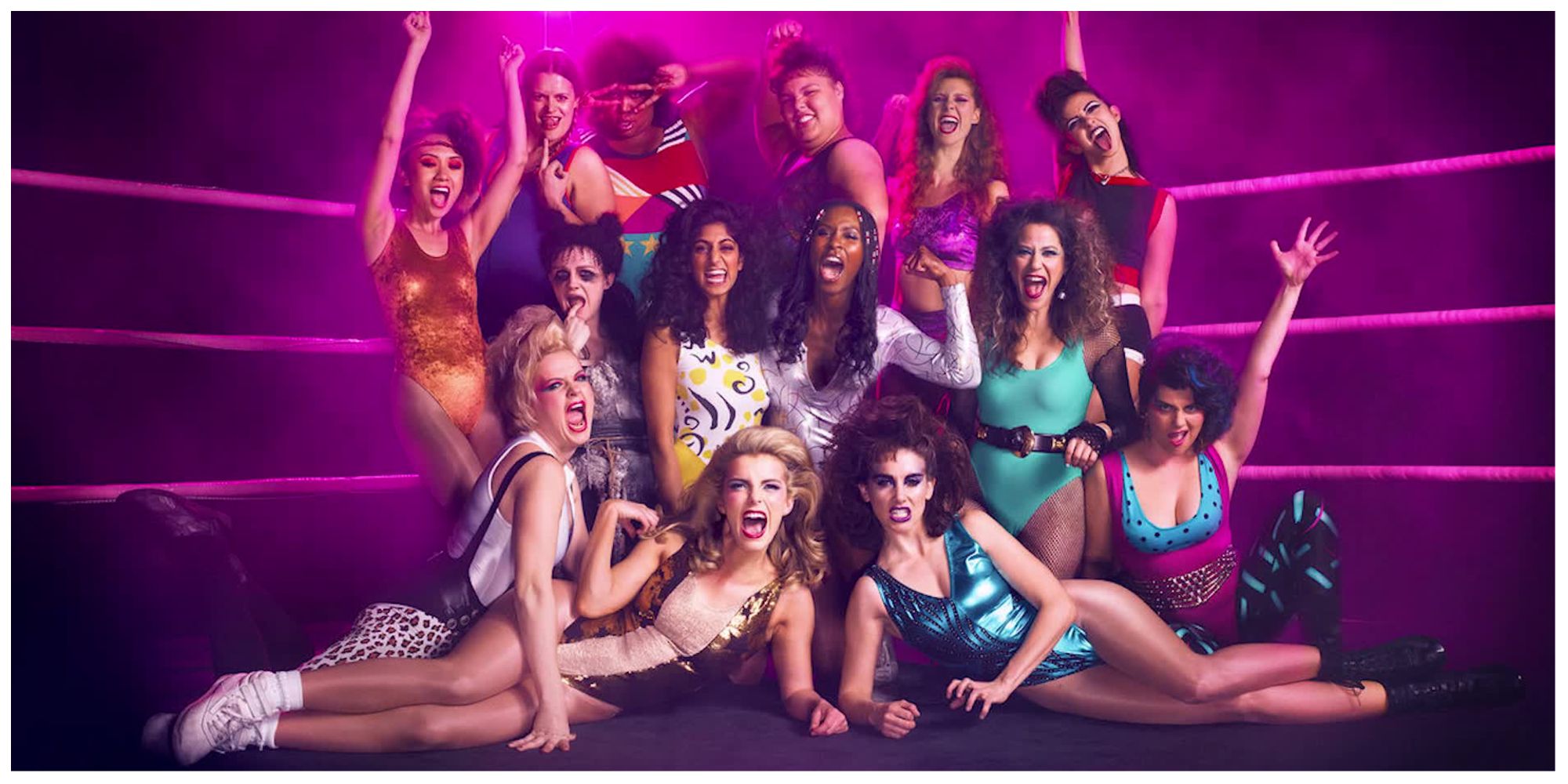 The cast of GLOW posing for a picture in the wrestling ring