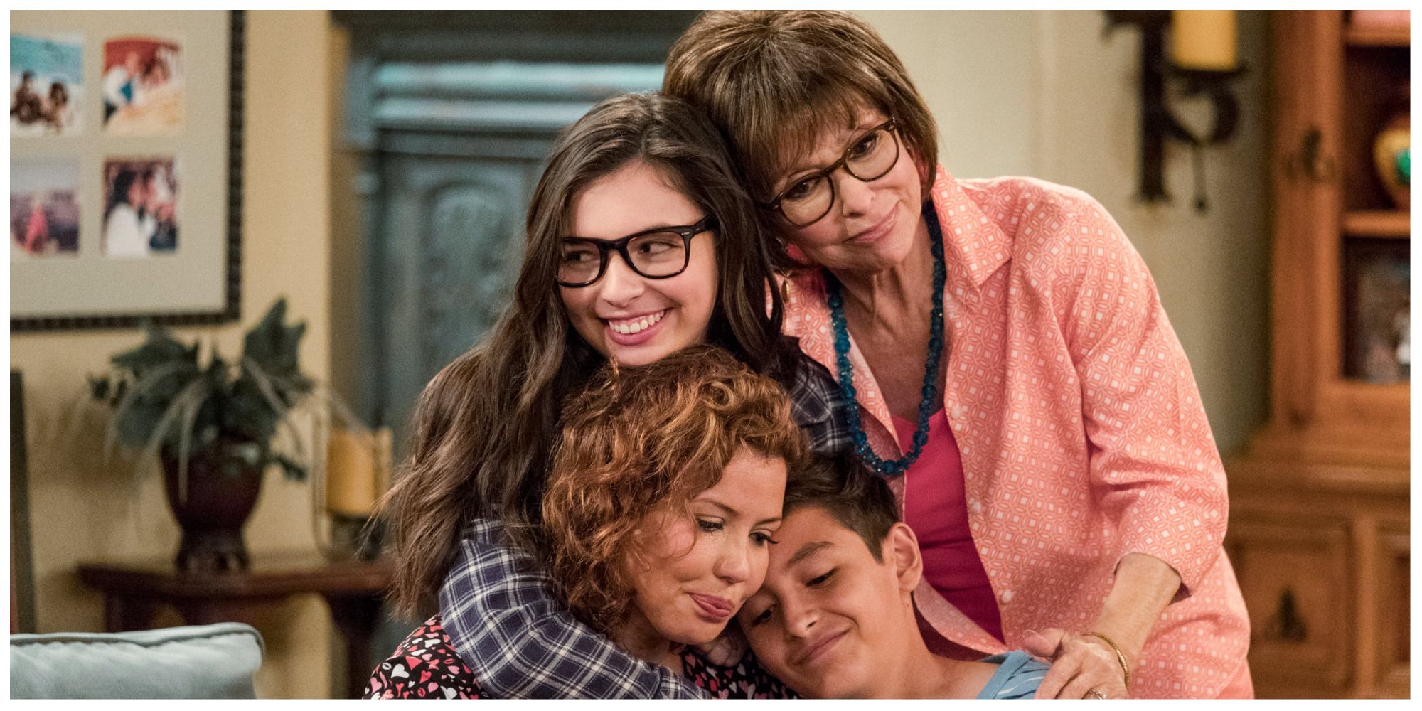 The Alvarez Family, Penelope and her kids, Elena, Alex and Grandmother Lydia in a family hug.