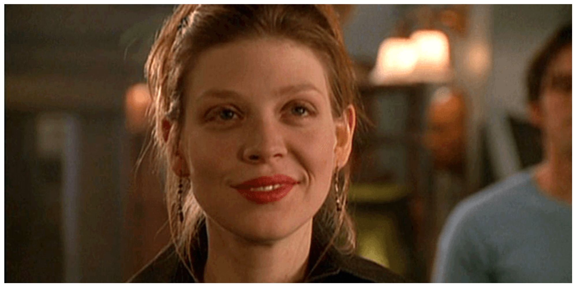 Tara in buffy the vampire slayer smiling at someone offscreen