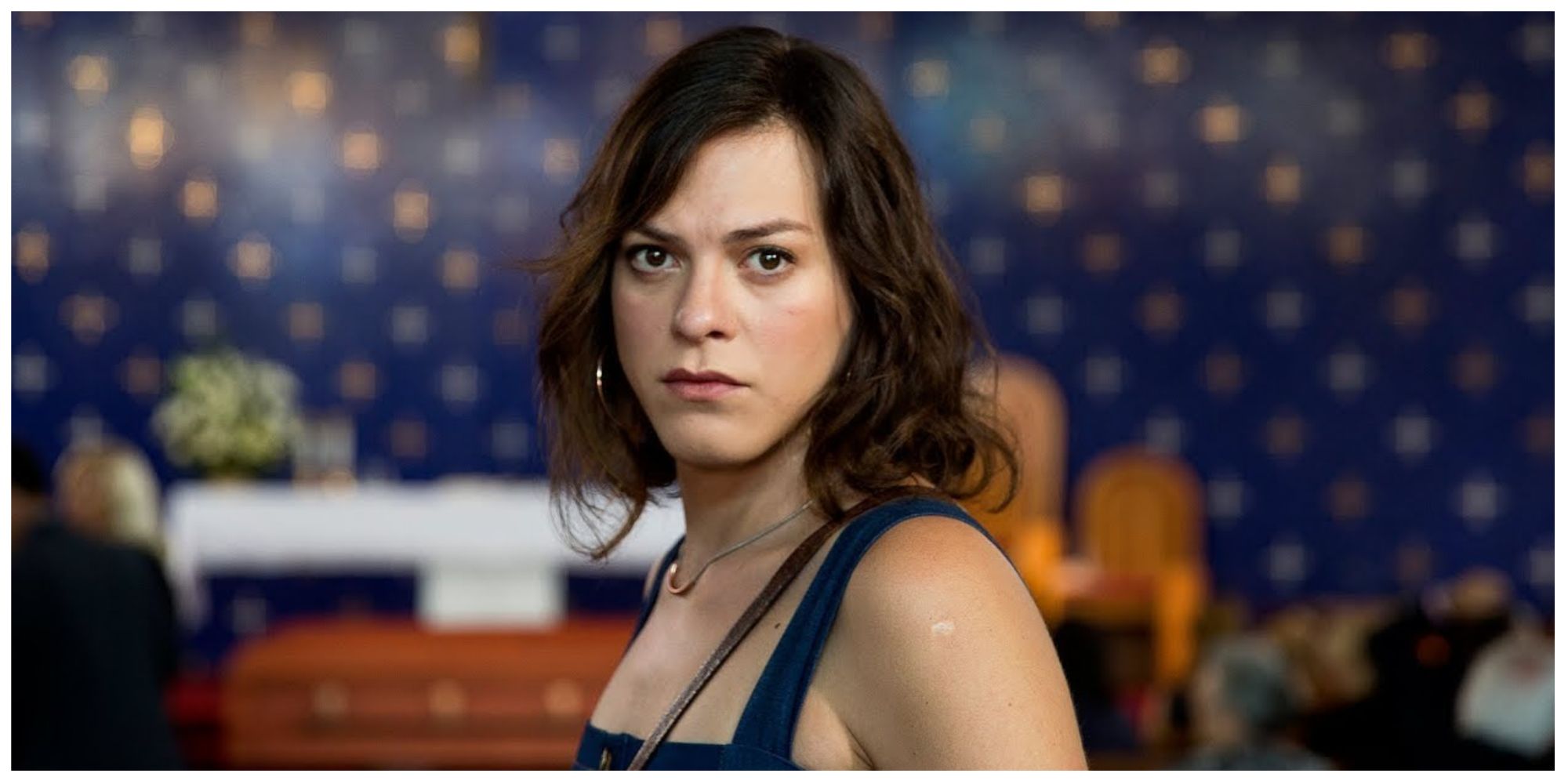 Marina in A Fantastic Woman staring straight ahead with a look of concern on her face