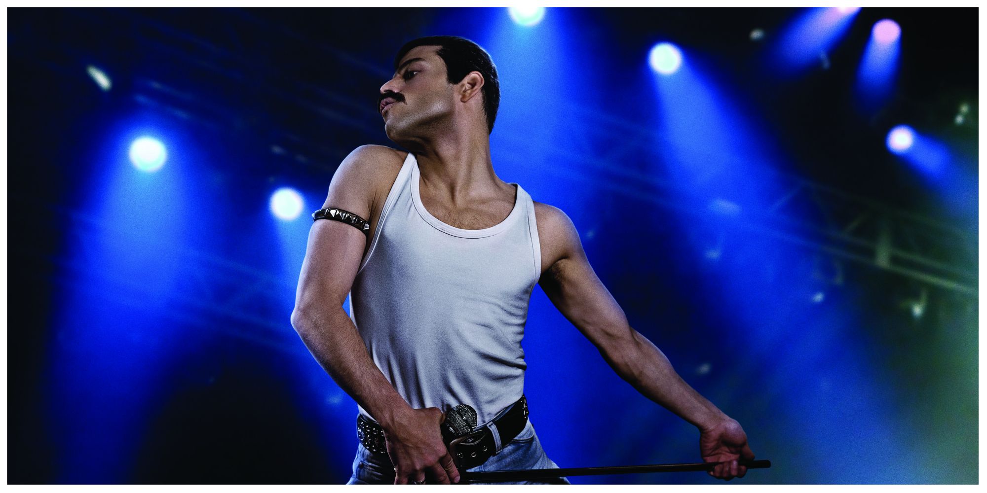 Rami Malek dancing on stage as Freddie Mercury