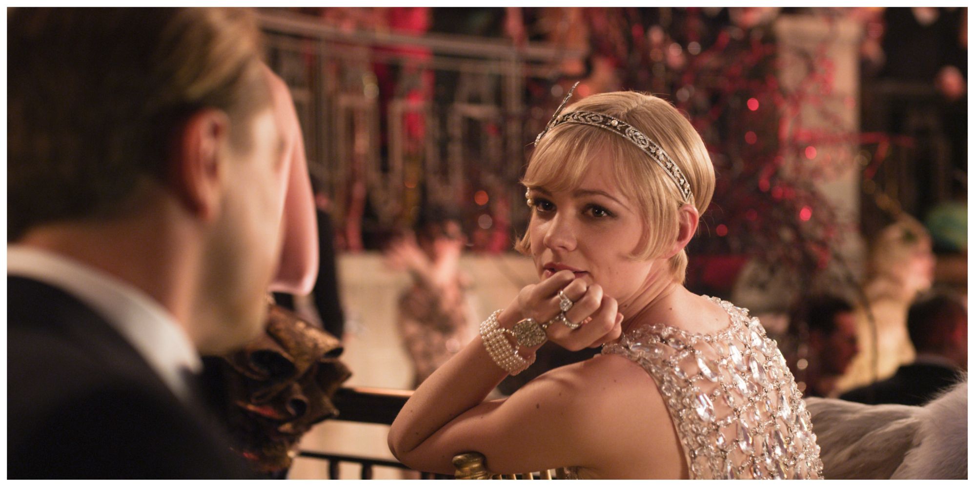 Carey Mulligan as Daisy in The Great Gatsby looking at Gatsby (offscreen)