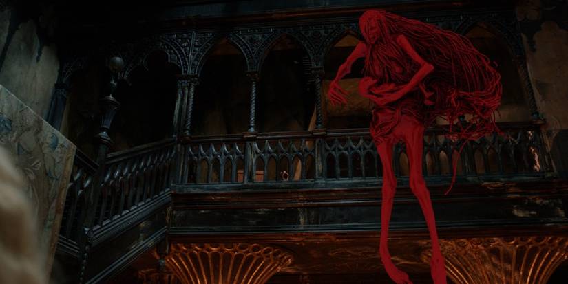 The red ghost of Enola Sciotti, reunited with her dead child in the afterlife.