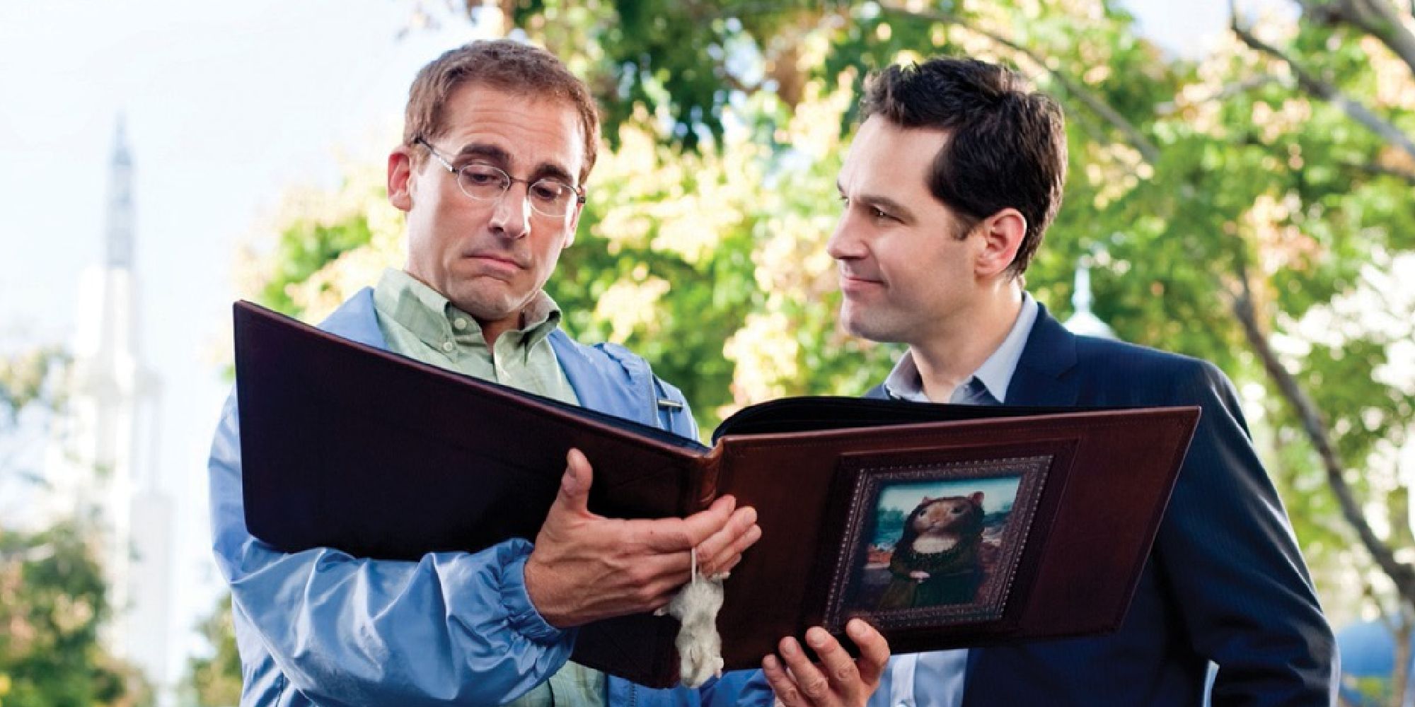 Paul Rudd and Steve Carell looking at a photo album in Dinner for Schmucks