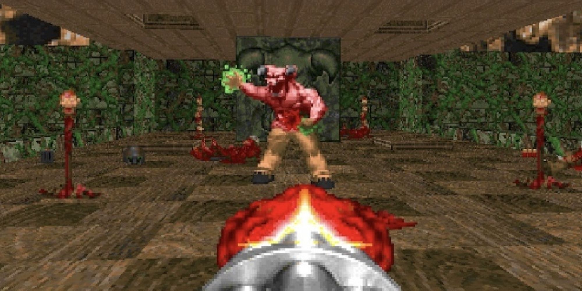 A gun barrel firing at a horned monster in Doom