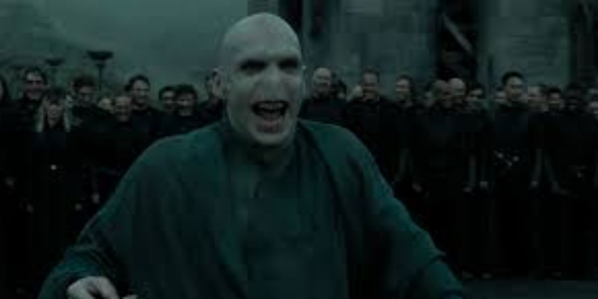 Lord Voldemort from Harry Potter and the Deathly Hallows part 2 with Death Eaters behind