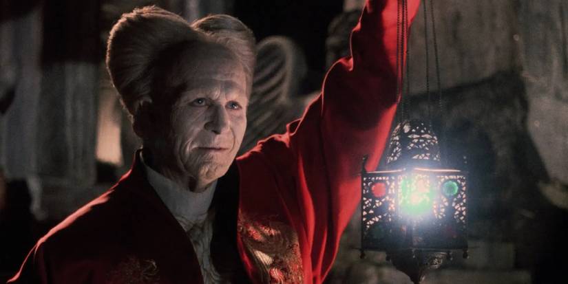 Gary Oldman's Dracula in his older form, carrying a lantern to illuminate his eccentric appearance.