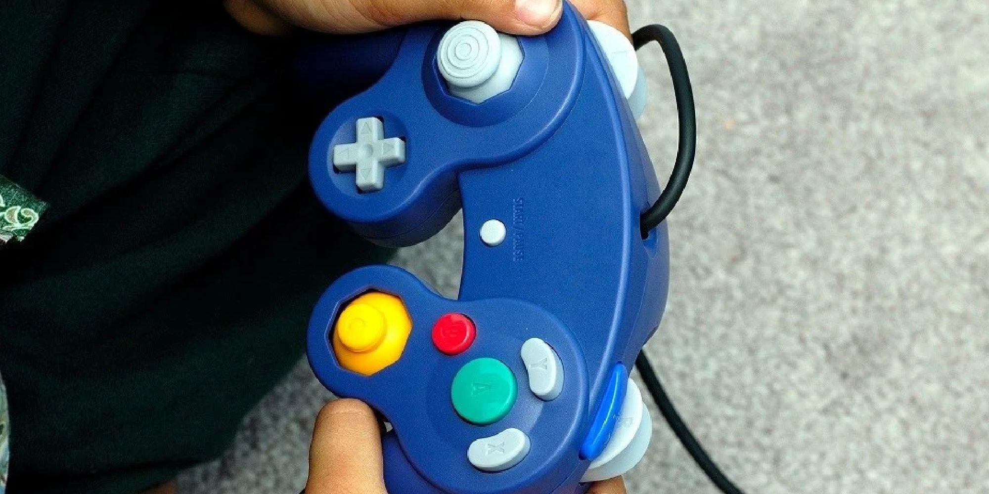 A player holding a GameCube controller