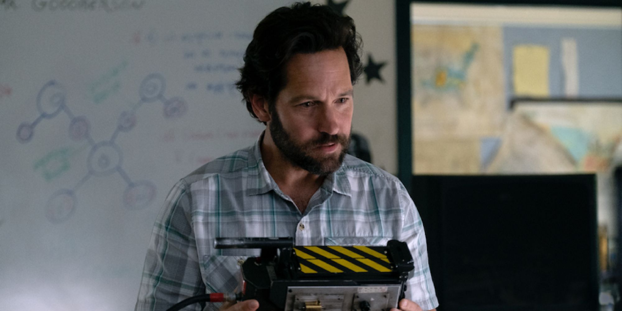 Paul Rudd holding a ghost trap in Ghostbusters Afterlife