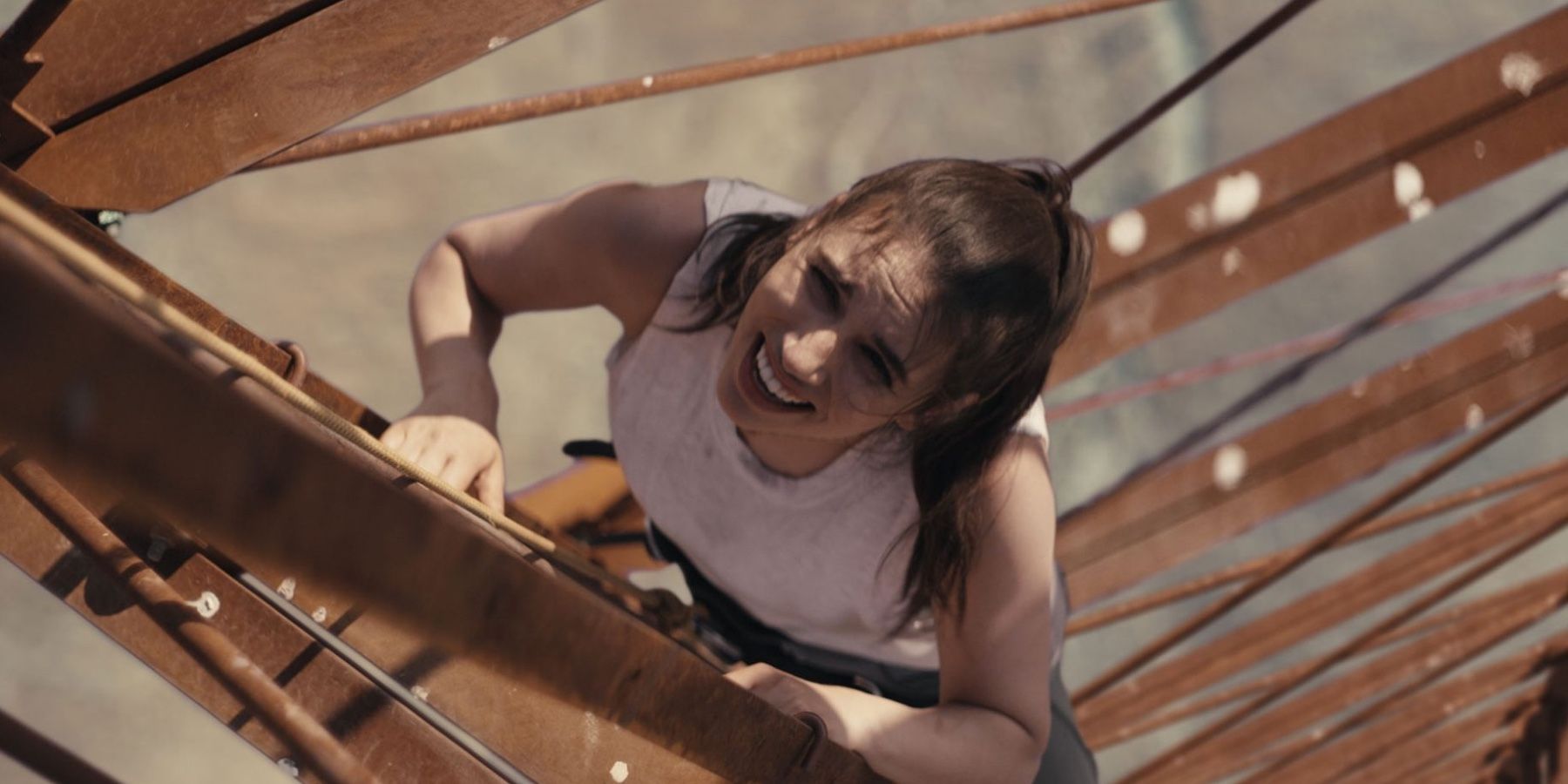 Grace-Currey-climbing-the-ladder-of-tower-in-Fall-2022-Film