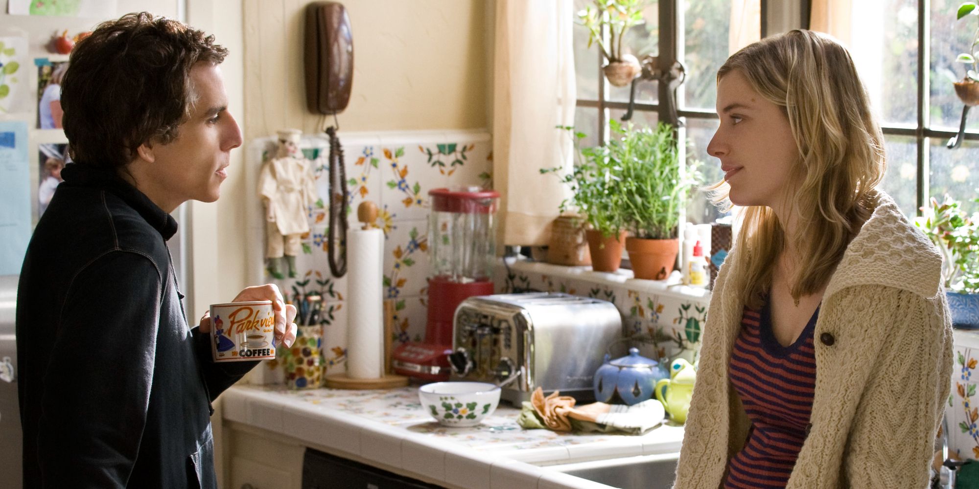 Ben Stiller and Greta Gerwig talking in a kitchen in Greenberg