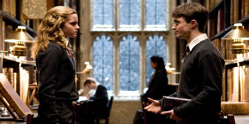 Harry Potter and Hermione Granger standing in Hogwarts Library