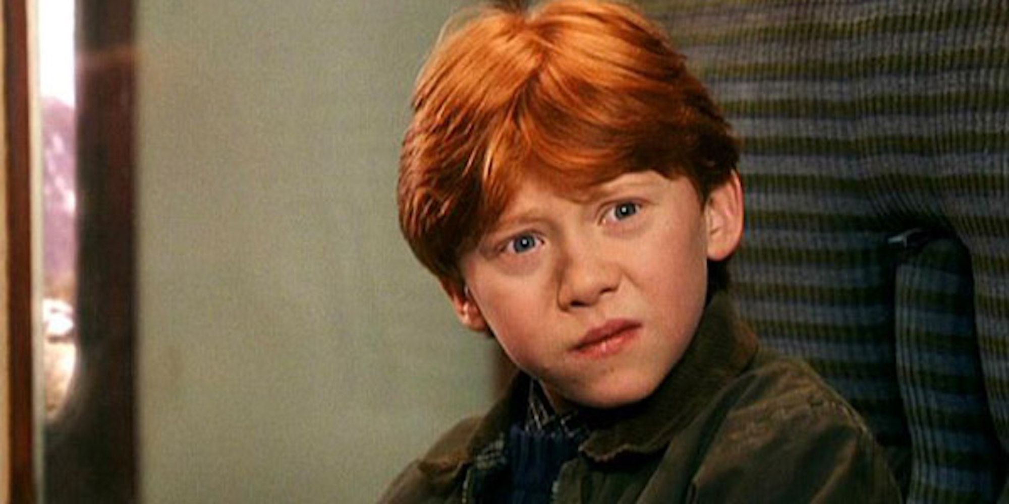 A young Ron Weasley looks confused on the Hogwarts Express