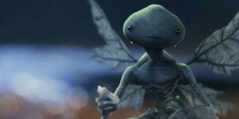 The Tooth Fair from Hellboy, holding a tooth in one of its hands. 