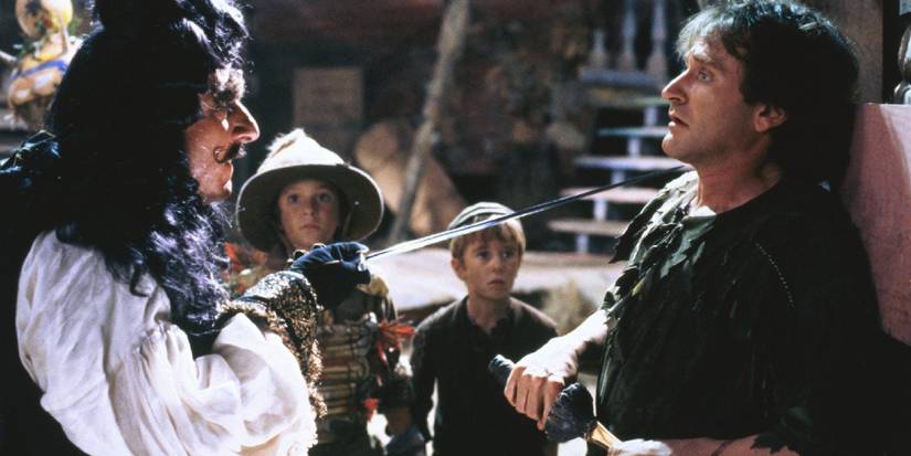 Hook thrusts a sword in a very flustered Peter's face as his children watch in fear.