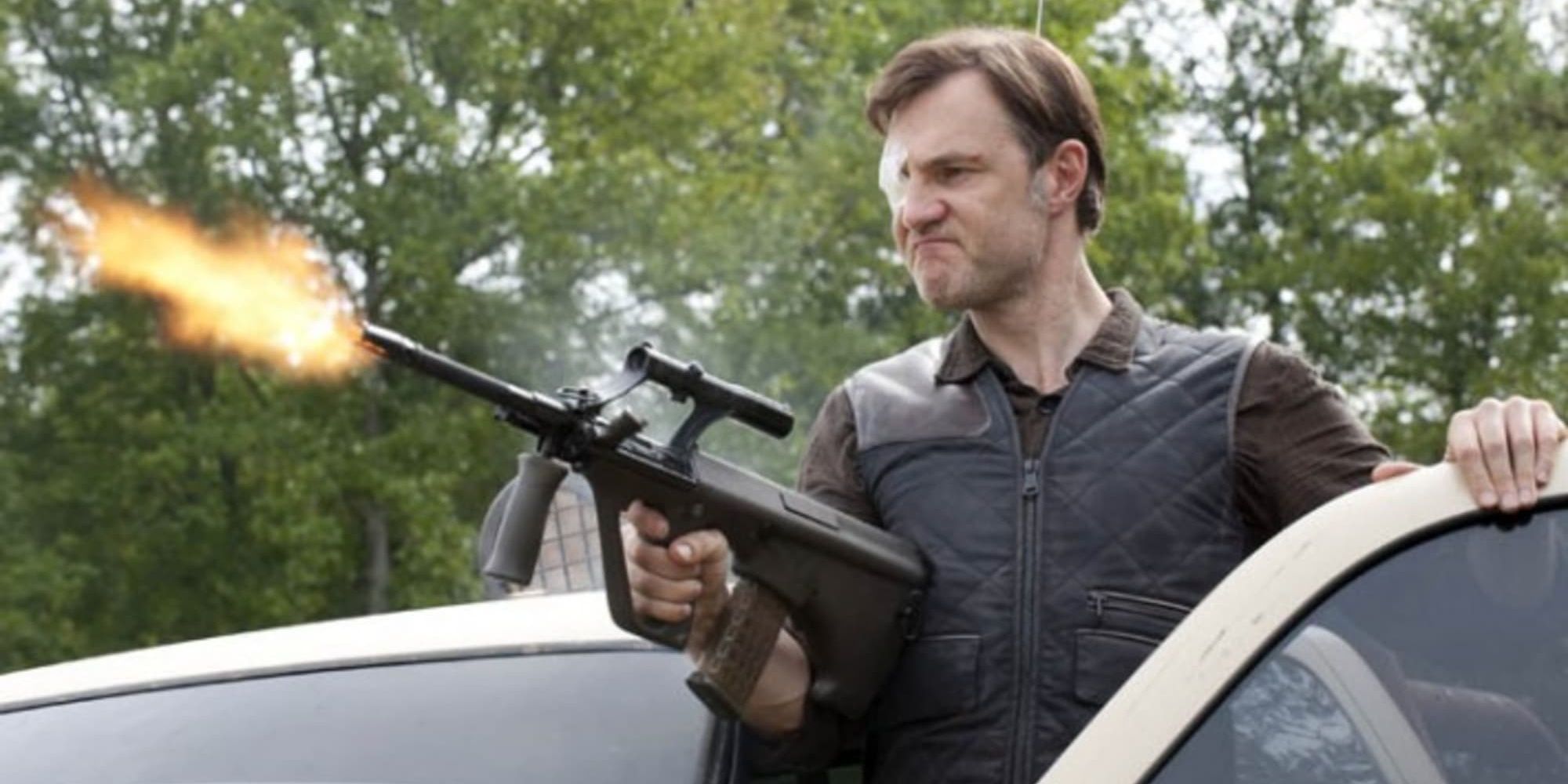 The Governor firing a gun in The Walking Dead