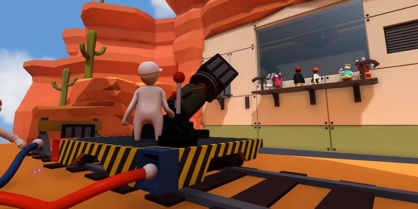 A giant magnet on a minecart with a human in the middle of a mesa in Human Fall Flat