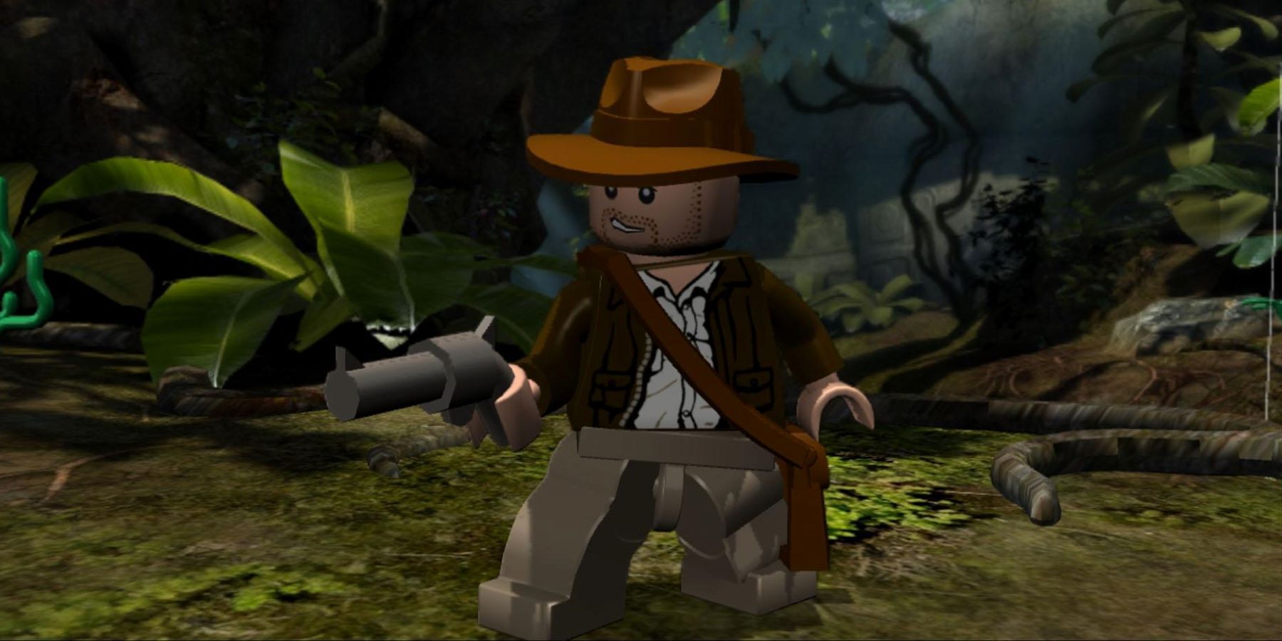LEGO Indiana Jones standing in a jungle and holding a revolver