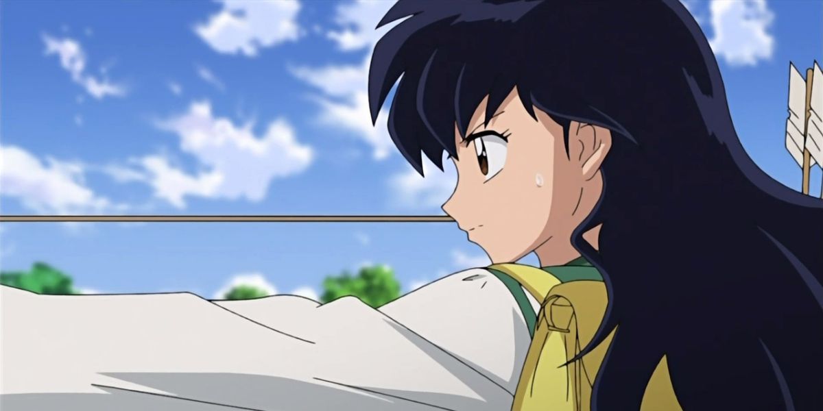 Kagome Higurashi from the anime, Inuyasha holding an arrow and aiming