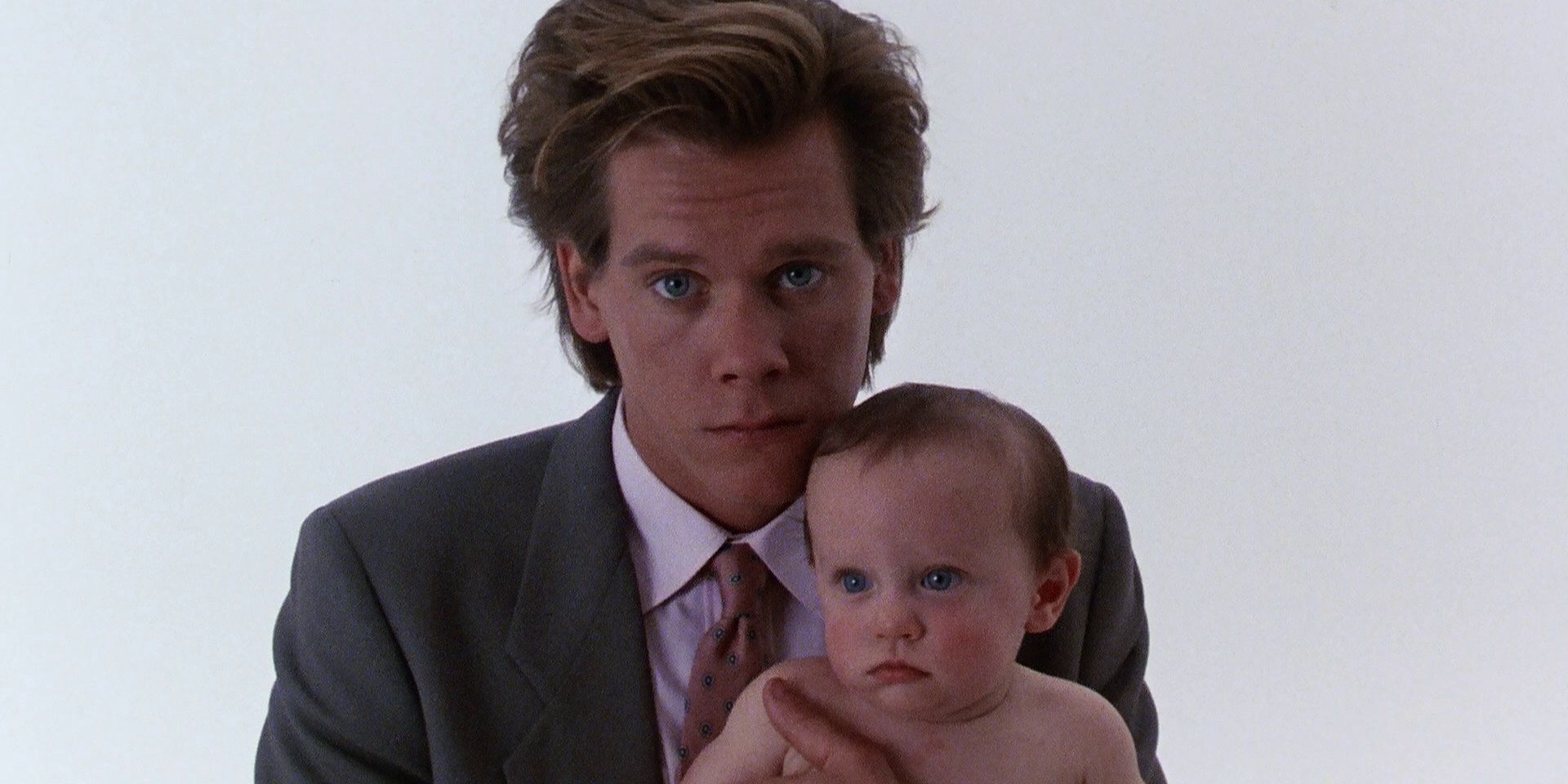 Kevin_Bacon_with_a_baby_in_She's_Having_a_Baby