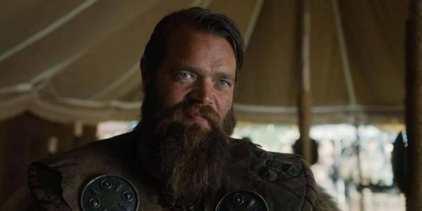 Prince Olaf in a tent wearing armour